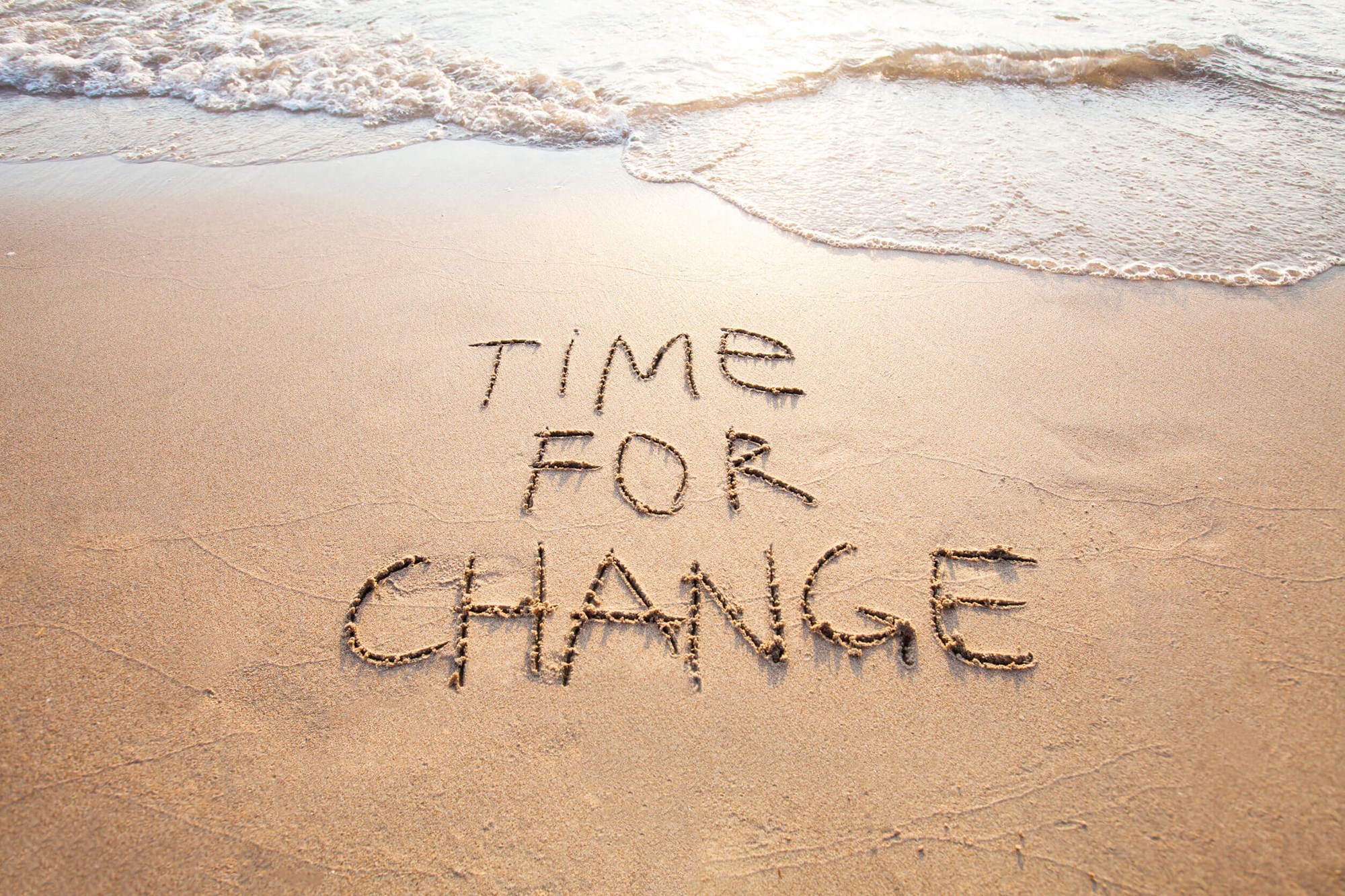Time for change, written on the beach